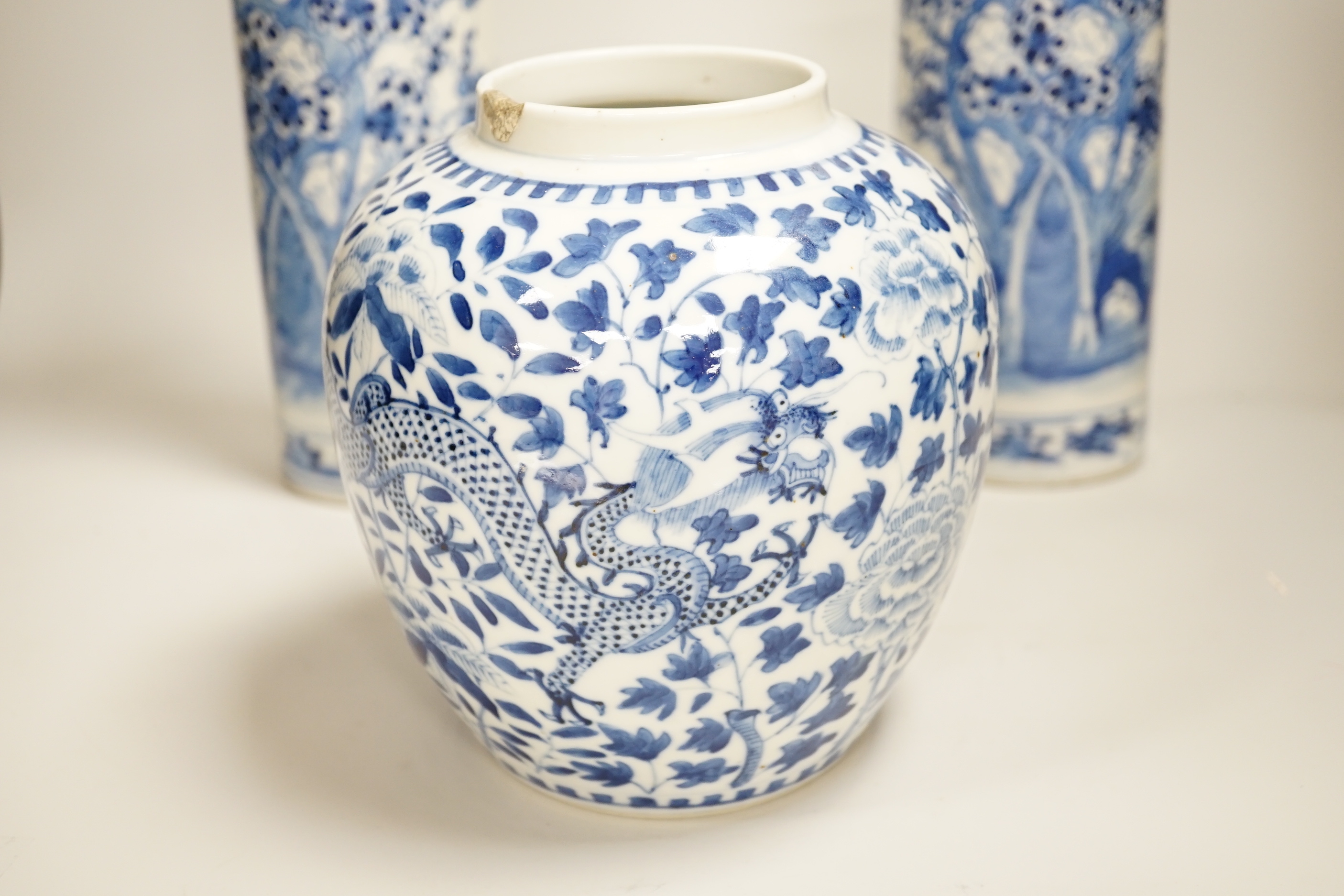 A pair of 19th century Chinese blue and white sleeve vases, and a similar ovoid ‘dragon’ jar, vases 31cm high